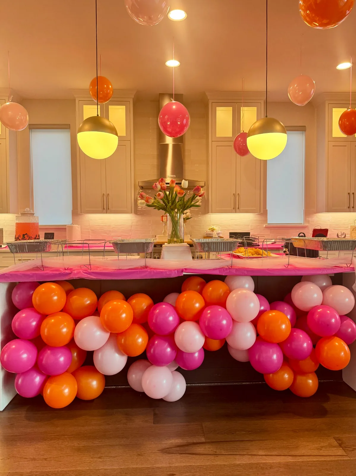 Pink, orange and blush balloon décor